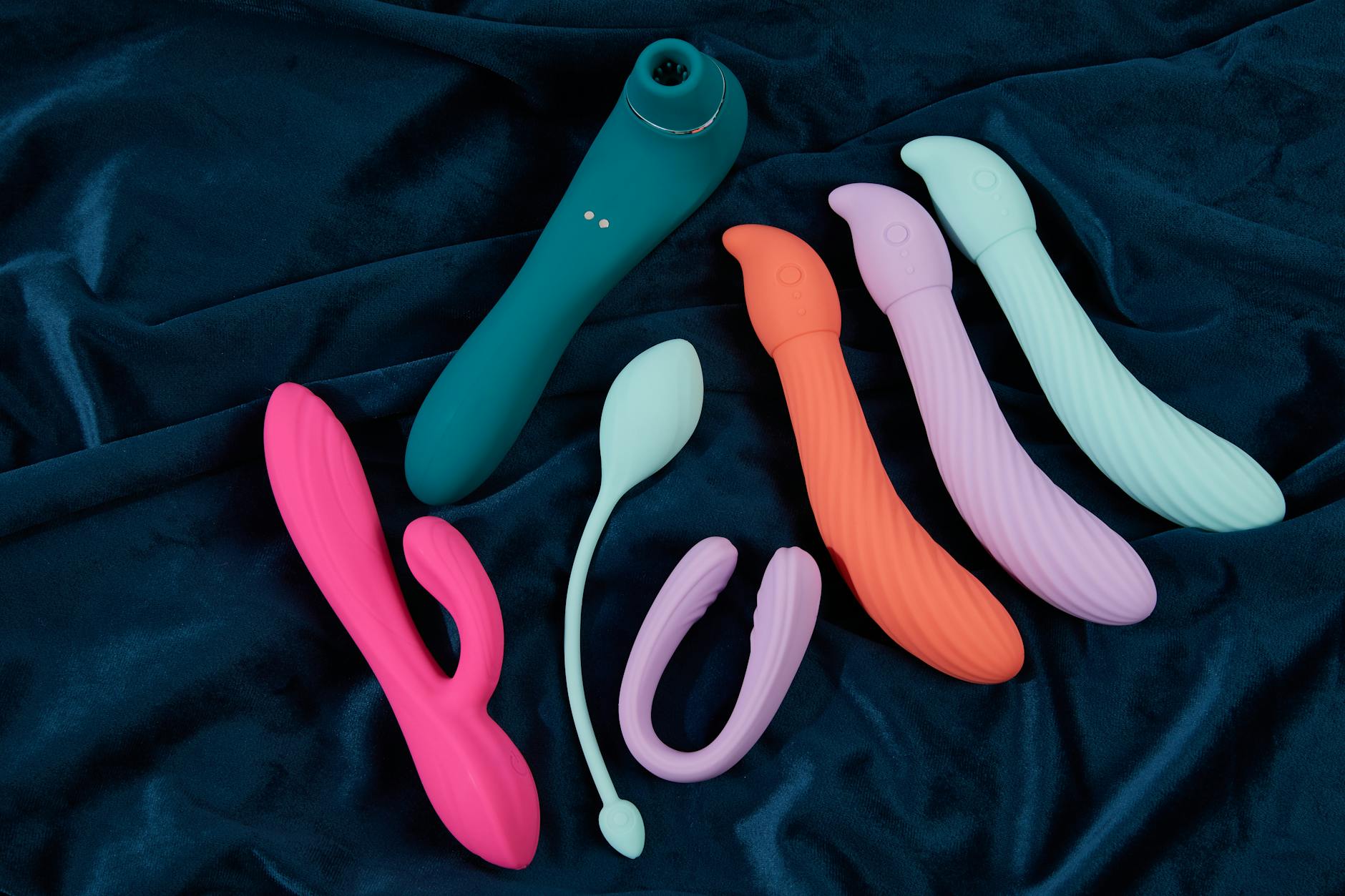 A couple standing together indoors, holding a vibrator, symbolizing shared intimacy and reconnection.