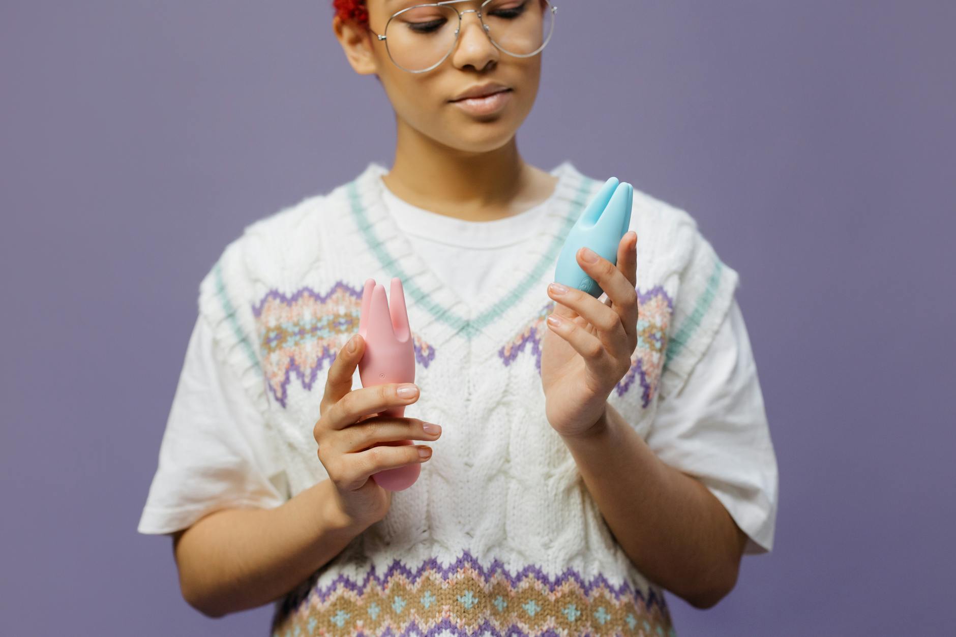 Woman holding a blue silicone vibrator, representing modern pleasure tools for high libido.